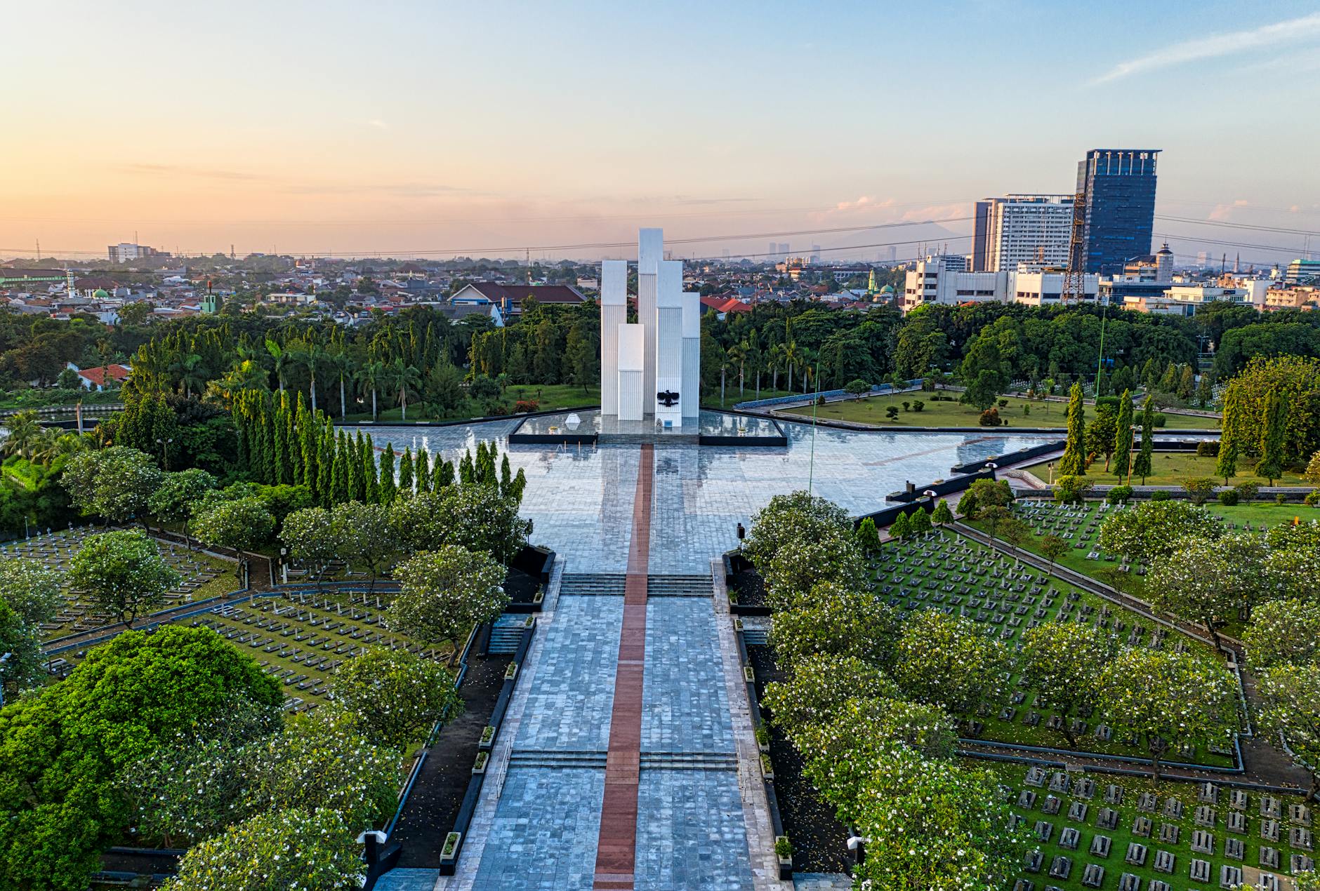 square surrounded by green terrain with gravestones in national cemetery