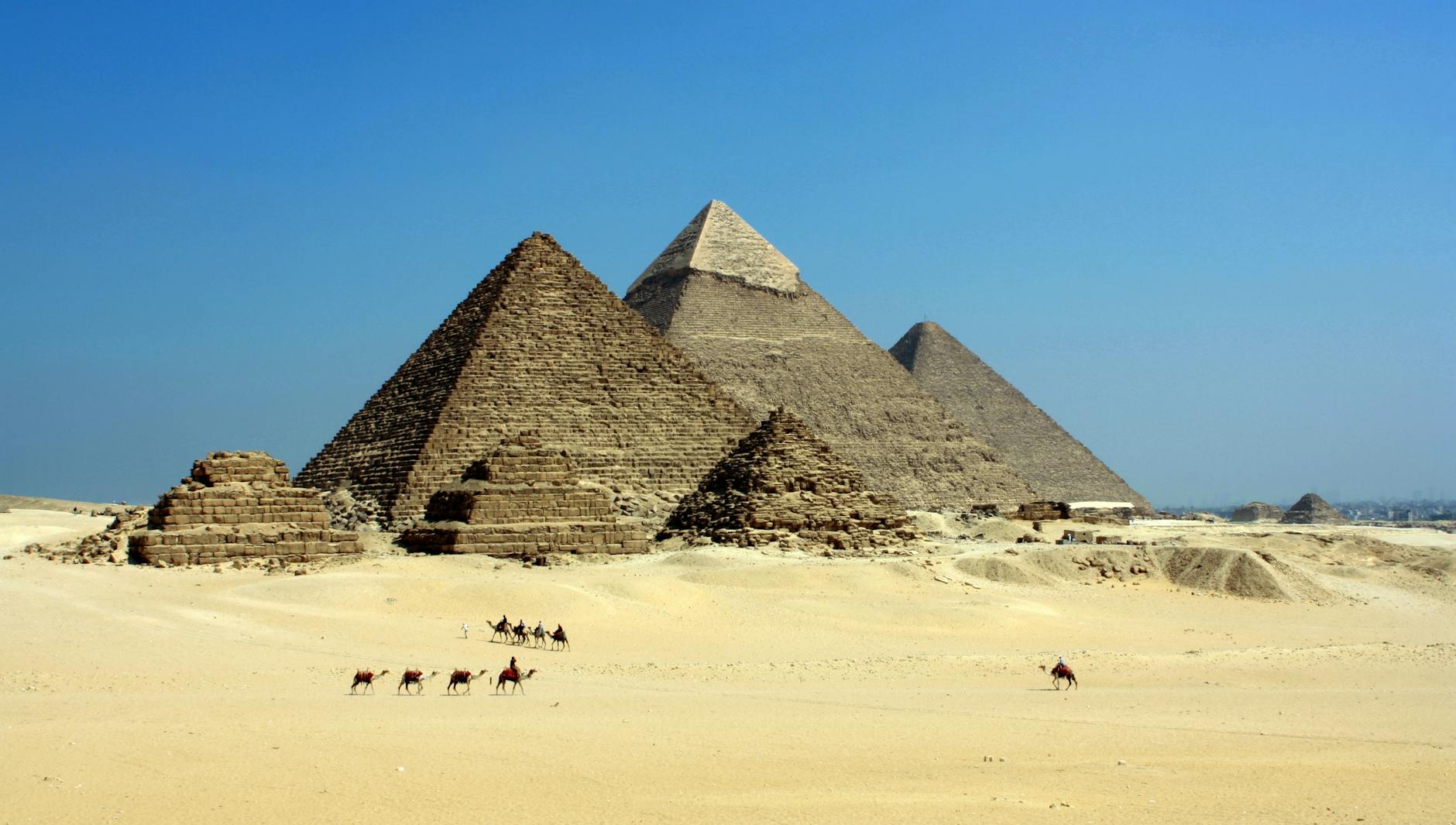 gray pyramid on dessert under blue sky